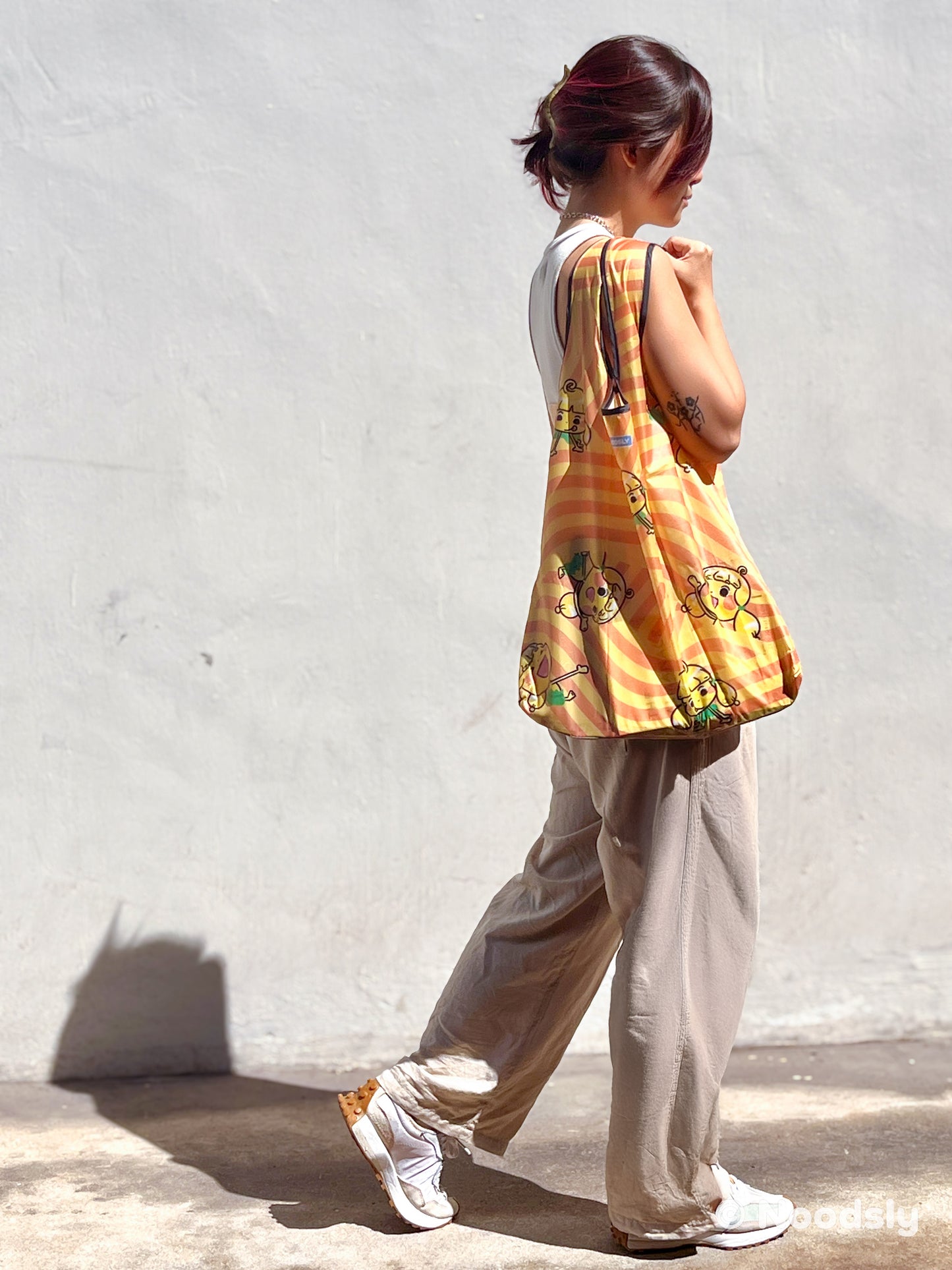 07) Noodsly Swirvy Orange Waterproof Foldable Bag
