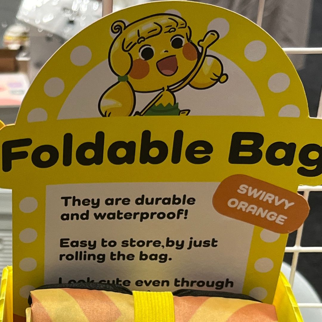 07) Noodsly Swirvy Orange Waterproof Foldable Bag